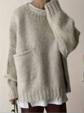 Sweater cuello redondo y bolsillos laterales