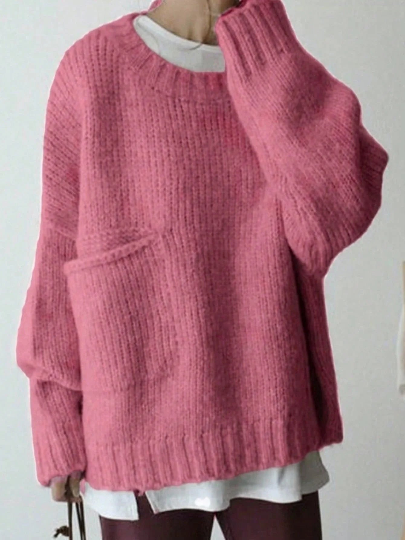Sweater cuello redondo y bolsillos laterales